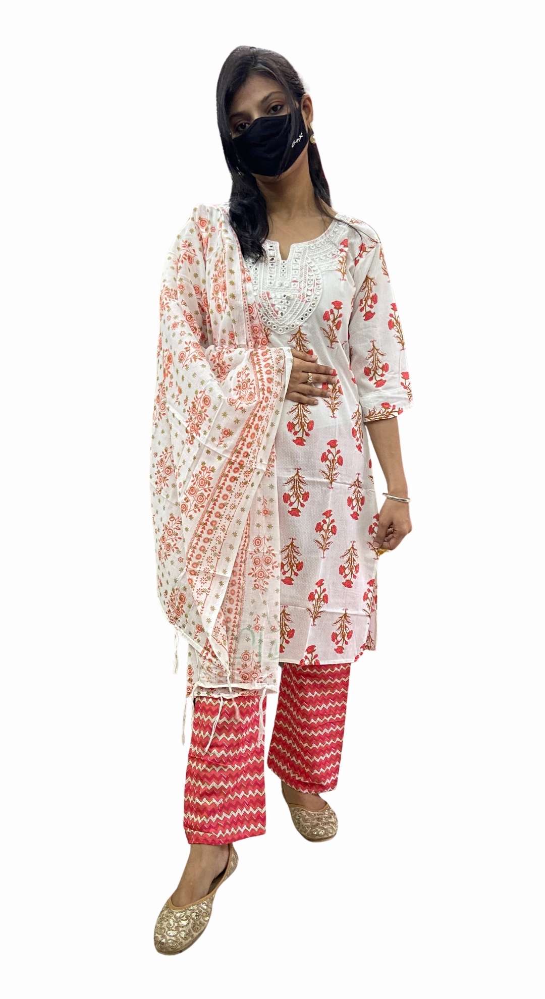 Woman wearing a white and red traditional outfit with a black mask on a white background