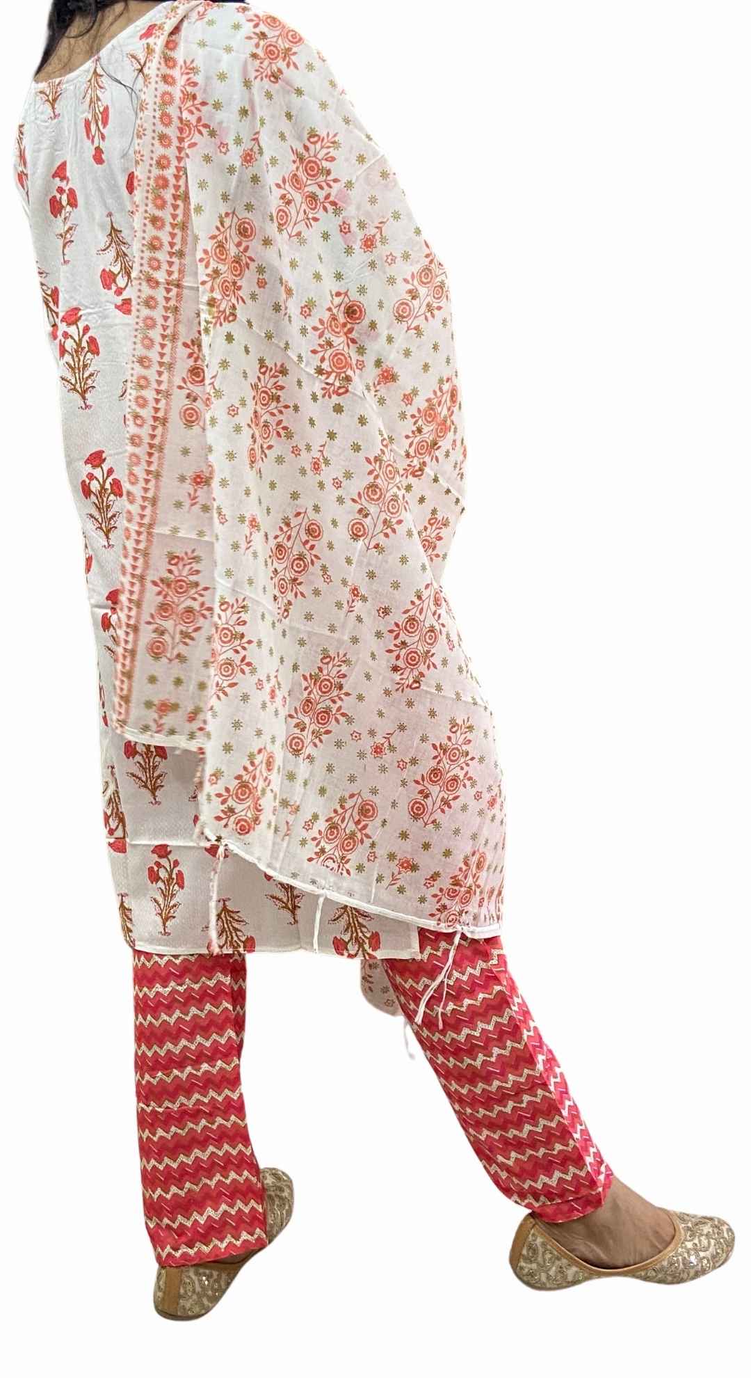 White kurta with red floral pattern and matching pants 